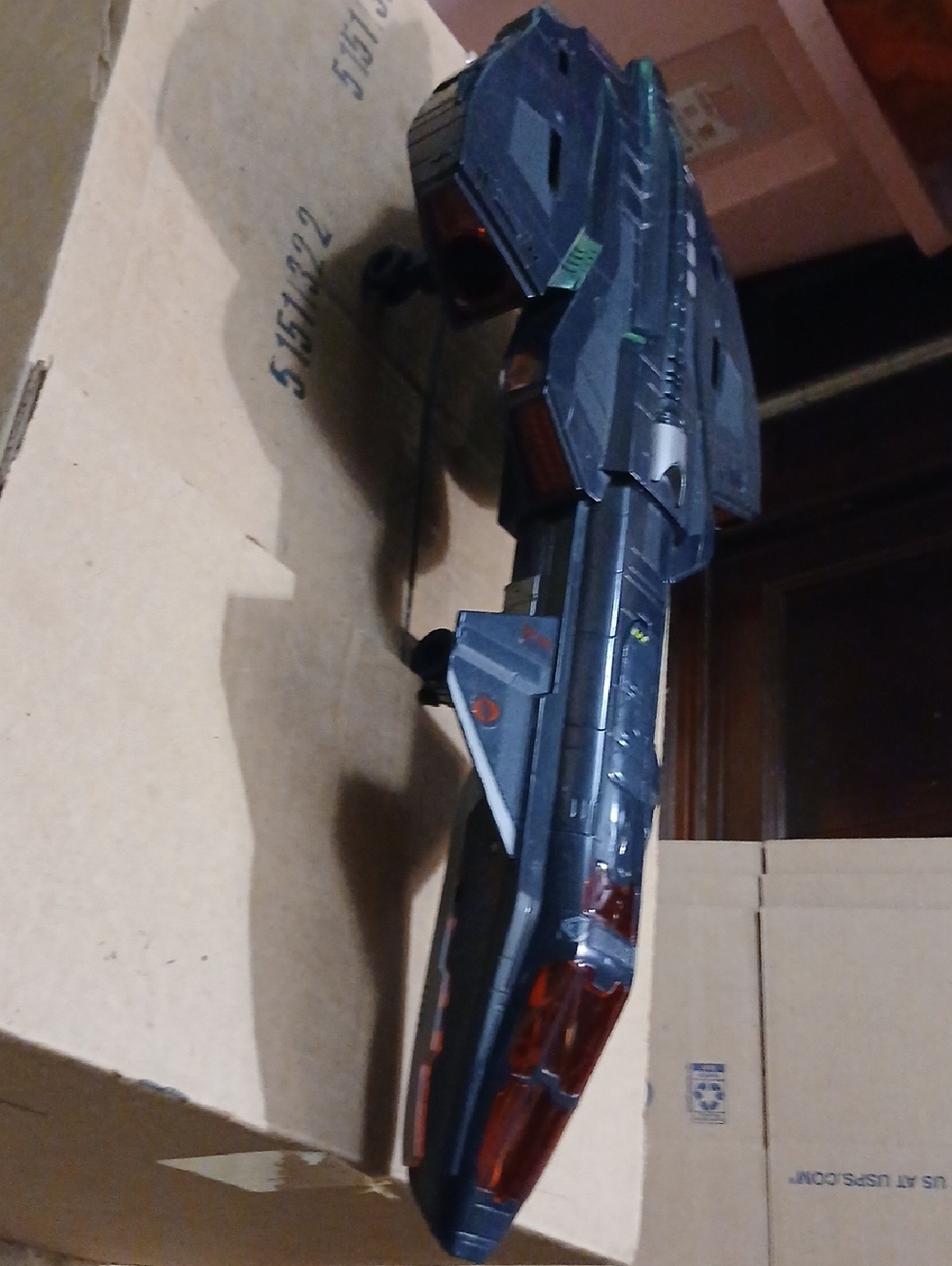Dark Gray Futuristic Toy Spaceship with Red Accents. Vintage